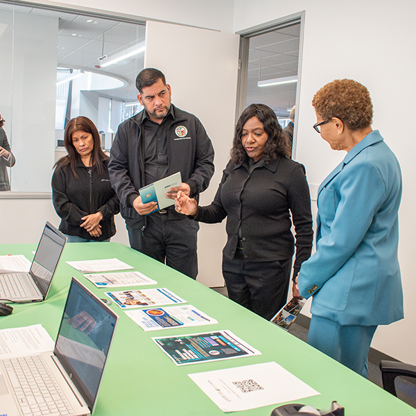 (right to left) Mayor Karen Bass, EWDD General Manager Carolyn Hull and District 13 Councilmember Hugo Soto-Martínez discuss available resources at the West LA Worker and Family Recovery Center